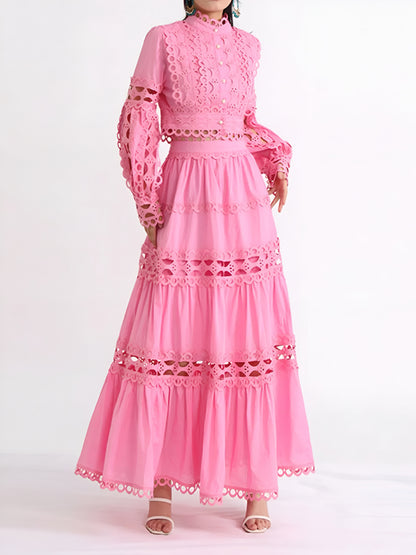 Elegant , formal pink long sleeve top and tiered maxi skirt with lace and cut-out details on a white background