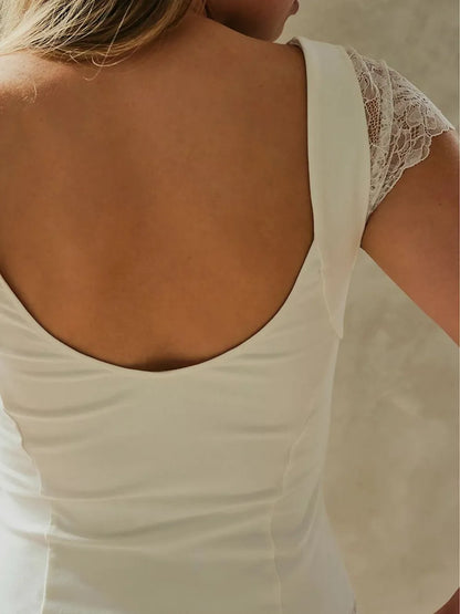 Close up of Lace Detail V-Neck Cap Sleeve Top back view on a neutral background
