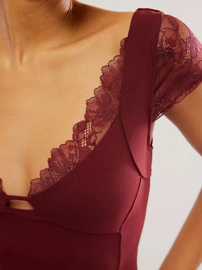 Close-up of a burgundy/maroon Lace Detail V-Neck Cap Sleeve Top on a neutral background