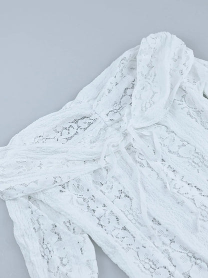 Close-up of a neckline of white Lace Off-Shoulder Maxi Dress with Flounce Sleeves on a light gray background