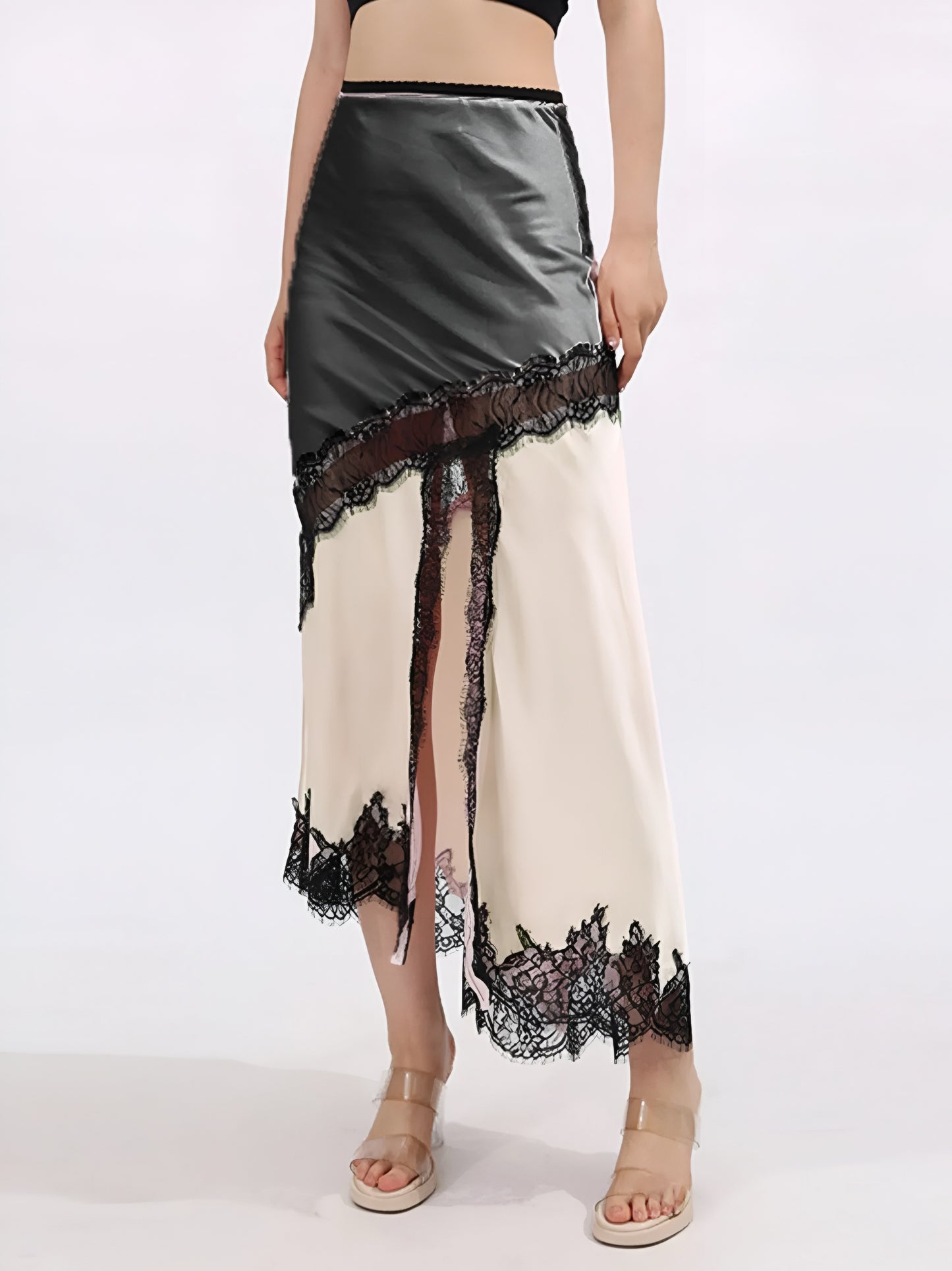 Woman wearing a fashion midi skirt with black lace trim and contrast cream/ivory satin  on a white background