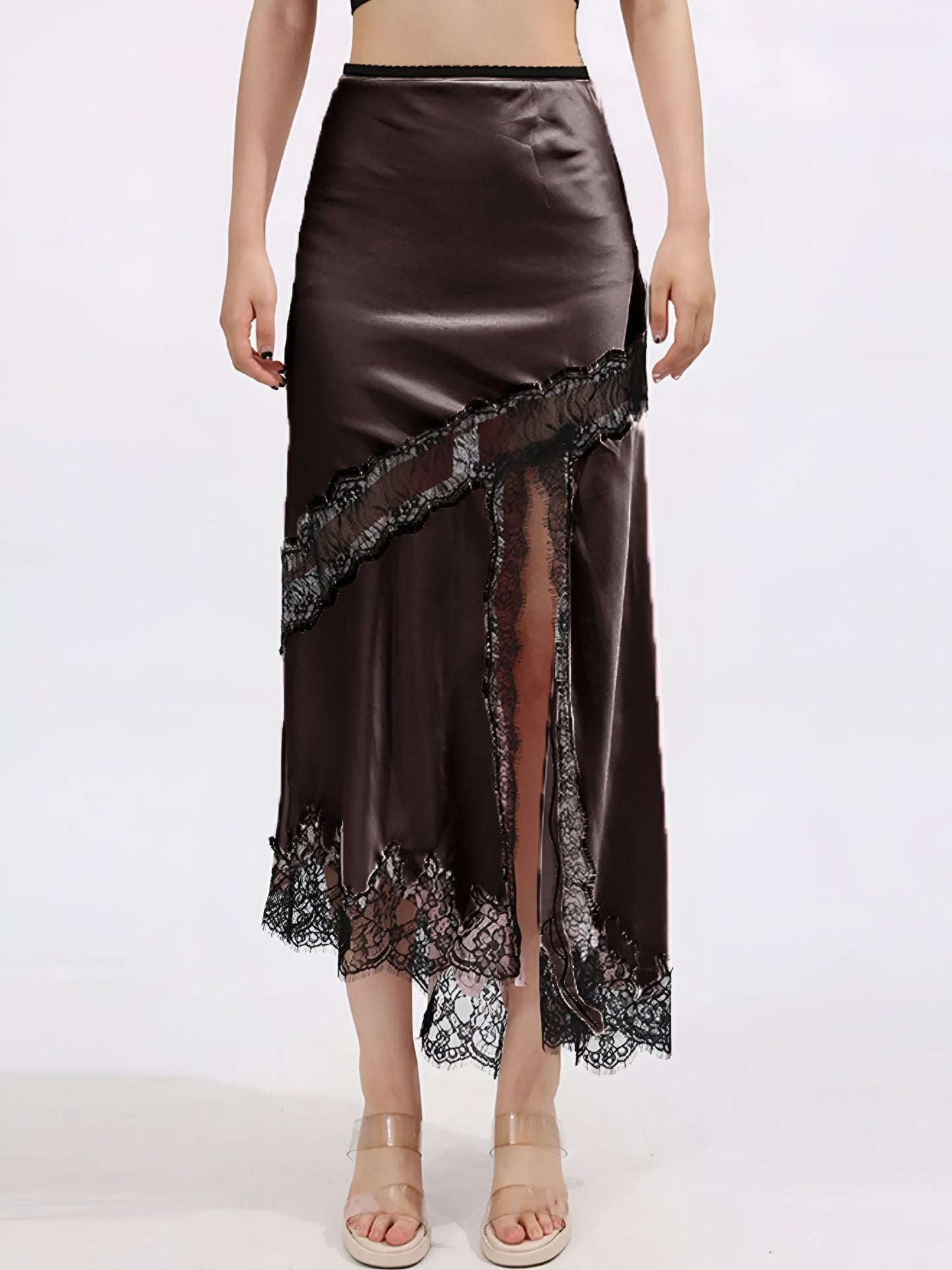 Woman wearing a luxury brown satin midi skirt with lace details and front slit on a white background