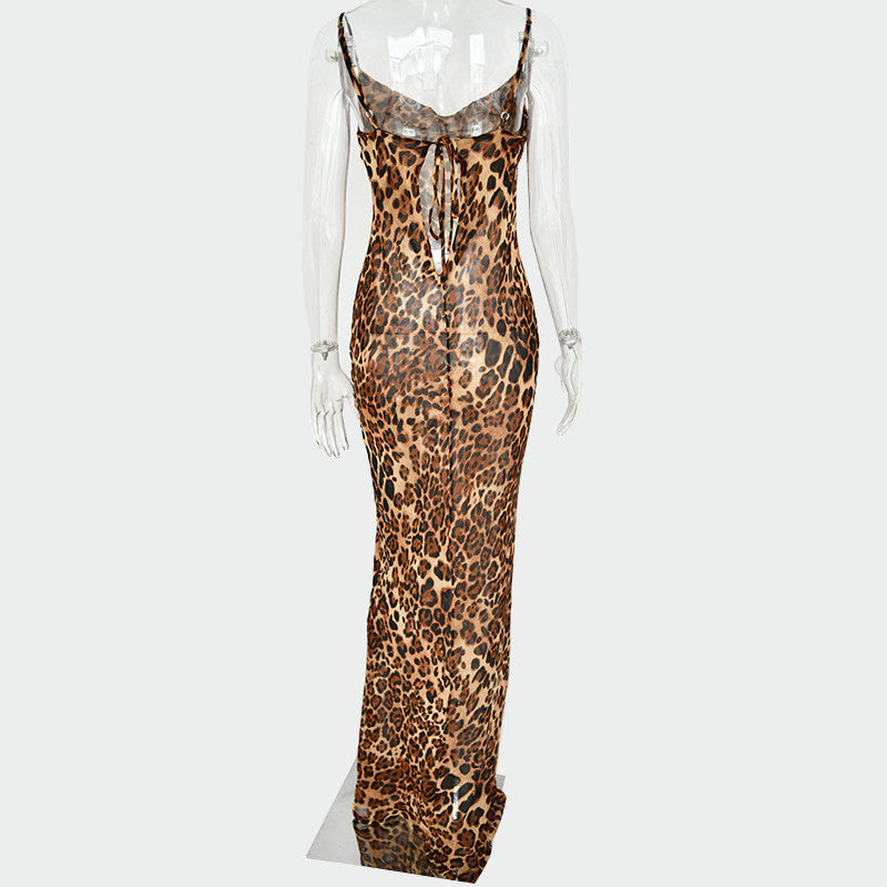 Back view of leopard animal print sleeveless bodycon maxi dress with a cowl neckline and lace-up back on mannequin