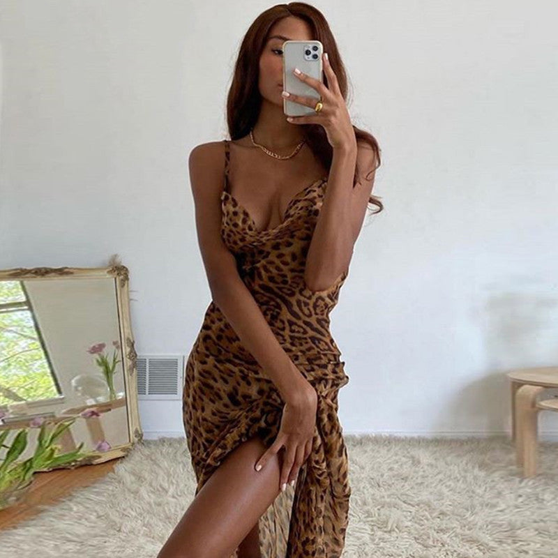 woman posing in a sleeveless bodycon leopard animal print maxi dress 