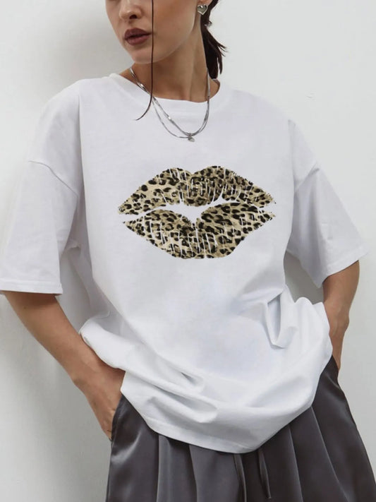 Model wearing oversized  leopard lip graphic and round neckline graphic tee with relaxed fit