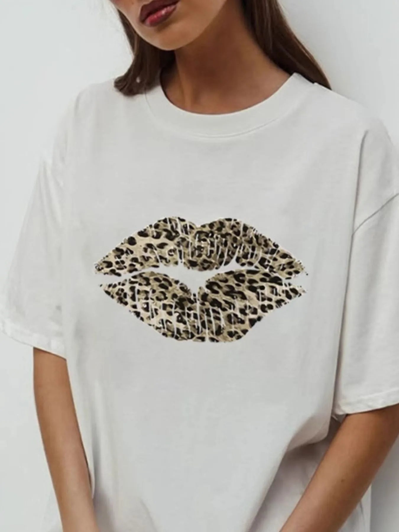 White leopard print lip graphic tee on model front view close up