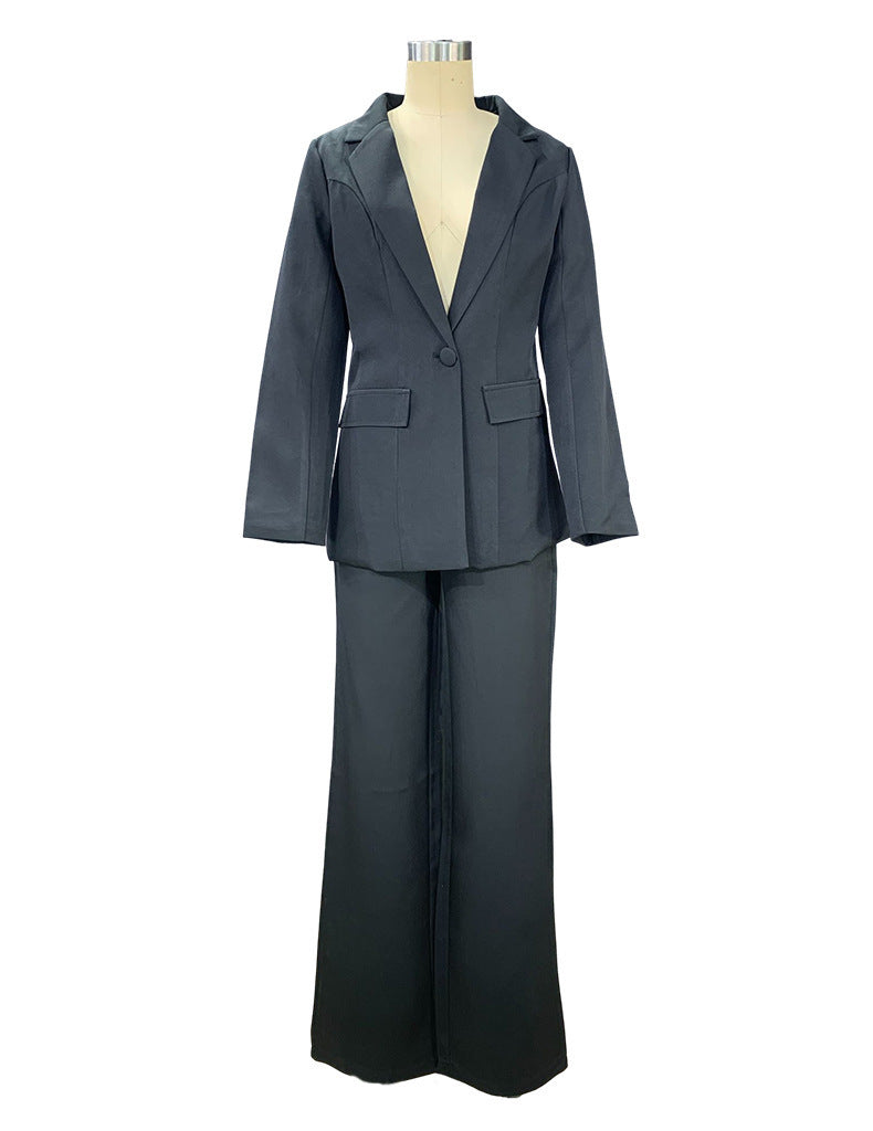 Black two piece tailored pant suit for women on a mannequin
