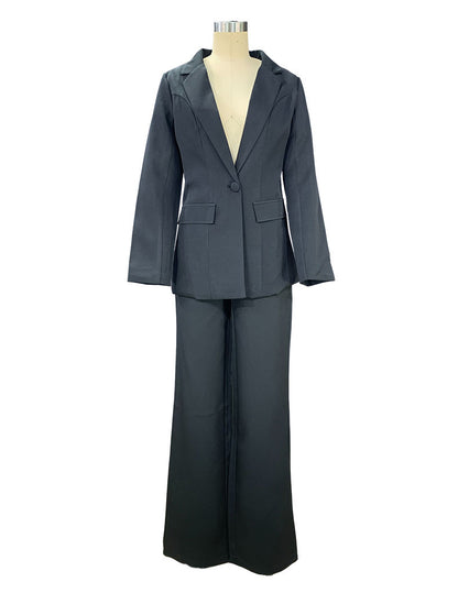 Black two piece tailored pant suit for women on a mannequin