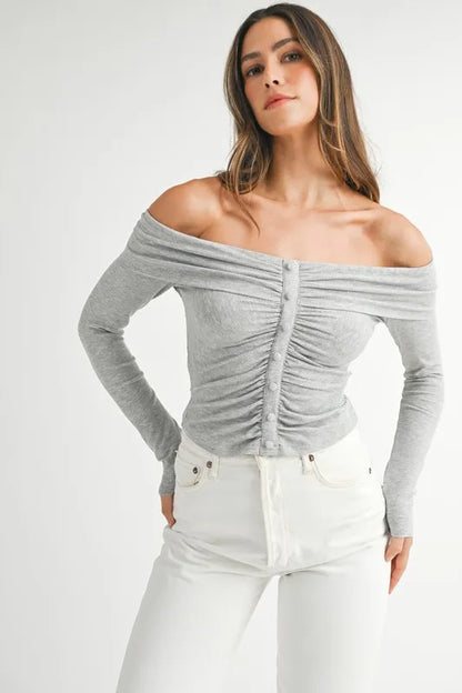 Model in off-shoulder long sleeve knit top with relaxed silhouette front view
