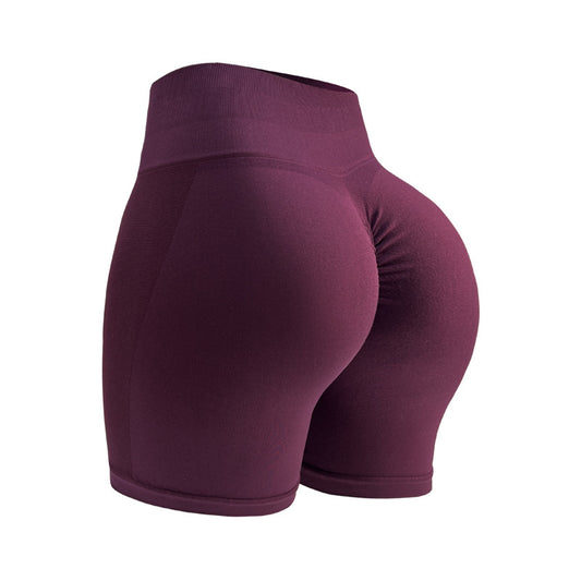 A pair of women's seamless active shorts in a vibrant deep purple color. These active shorts are designed to provide comfort and a flattering fit, highlighted by their smooth texture and elastic waistband.