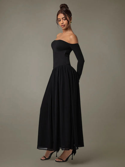 Side profile of flowing off-shoulder maxi dress with long sleeves on model