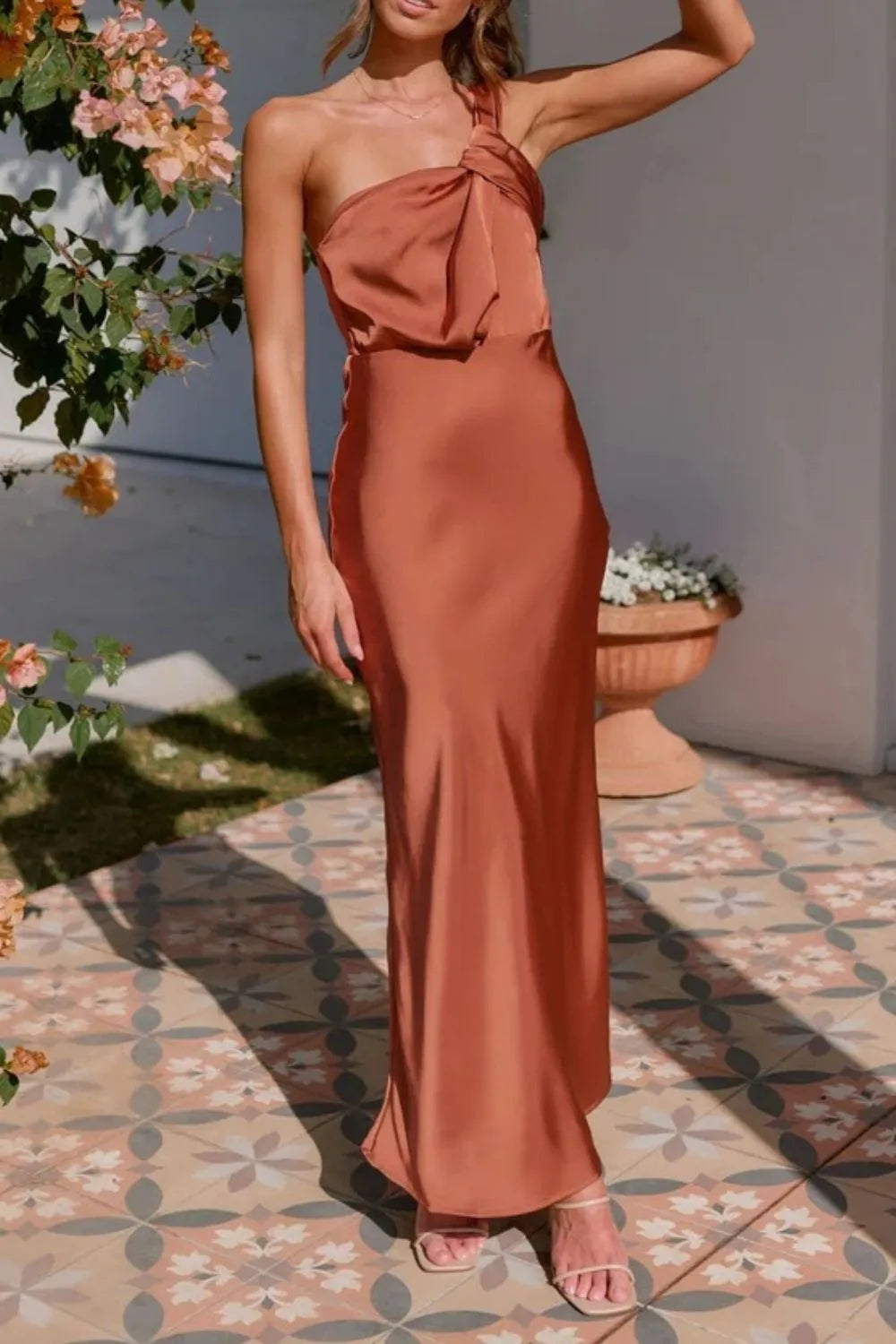 Model in sleek one-shoulder sleeveless maxi dress with sculpted fit front view