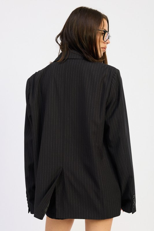 back view of woman wearing a black Trendy Women’s Pinstripe Blazer Outfit – Business Casual & Streetwear
