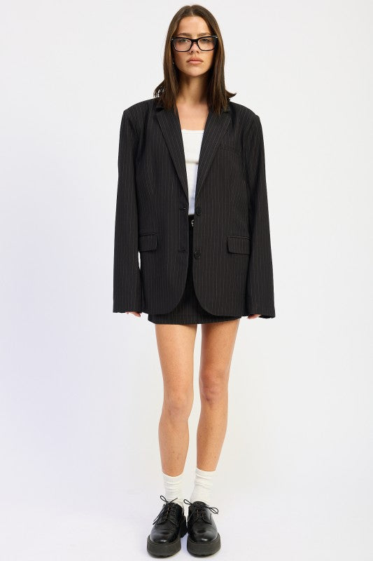 front view of woman wearing a black Trendy Women’s Pinstripe Blazer Outfit – Business Casual & Streetwear