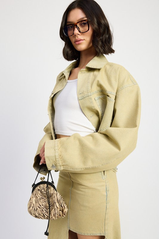 woman wearing a sandstone/beige washed Oversized denim jacket – luxury women’s outerwear