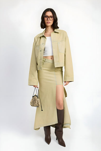 woman wearing a washed beige/sandstone button down oversized denim jacket styled with maxi slit draped denim skirt