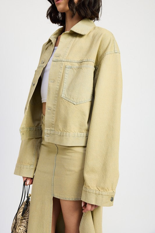 Side view of High-end oversized utility denim jacket neutral beige washed tone on model