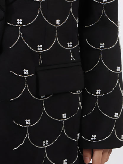 Close up of black luxury pearl-detail long sleeve blazer for women