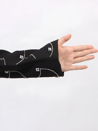 Black sleeve with white pearl details  on a white background
