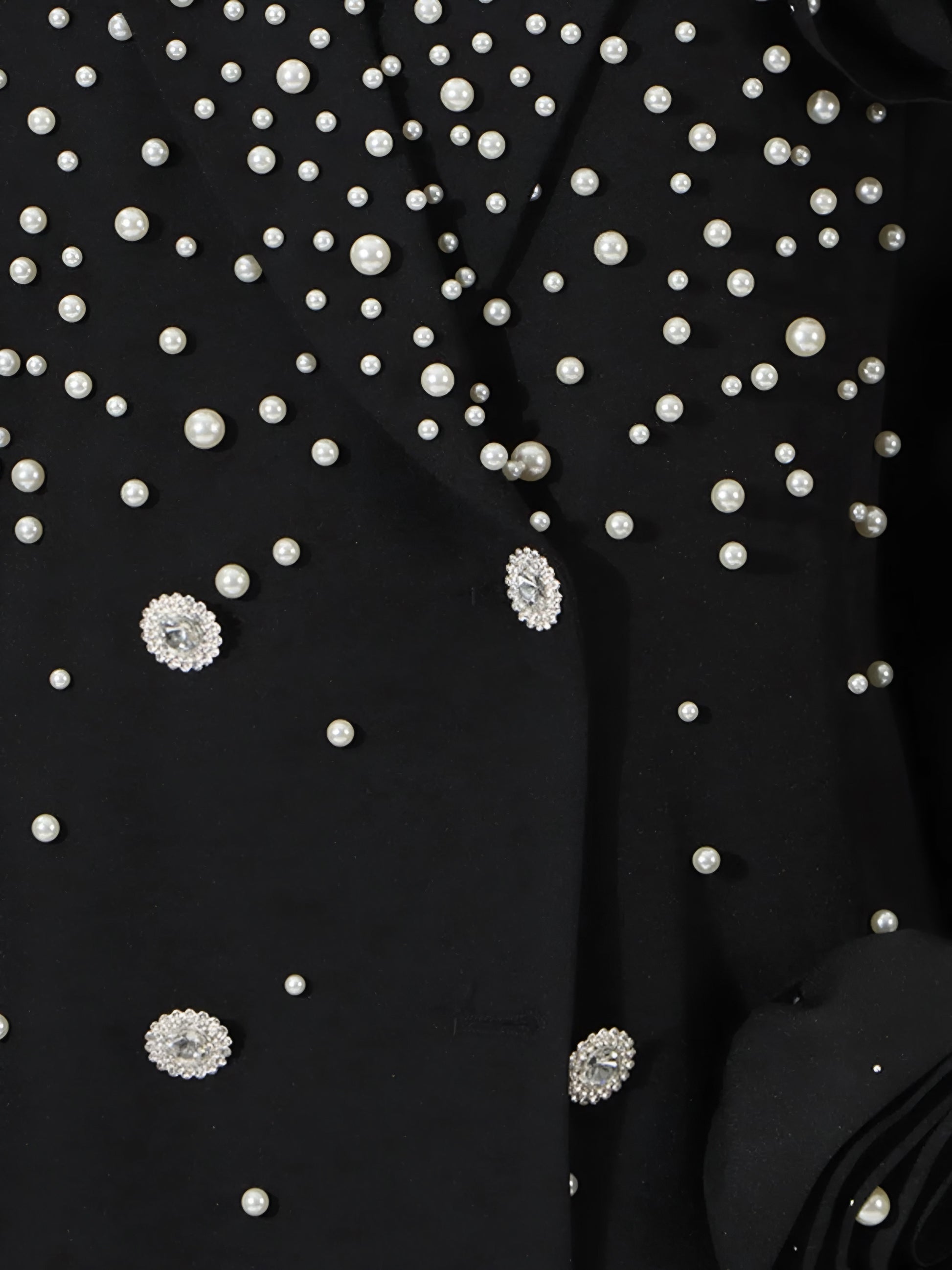Close up of Luxury pearl embellished black blazer for women