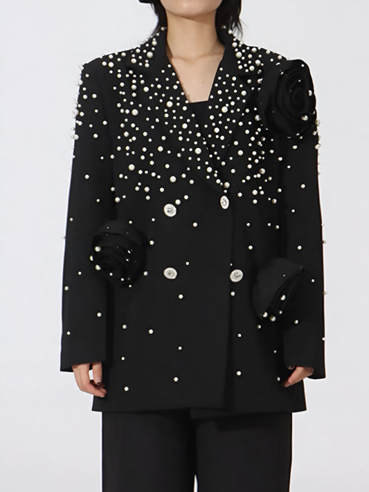Woman wearing a designer inspired high fashion luxury double-breasted blazer with pearl details and Crystal buttons.