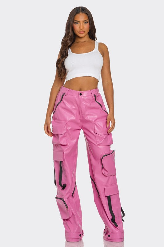 woman posing in a luxury pink utility cargo high rise pants with oversized pockets