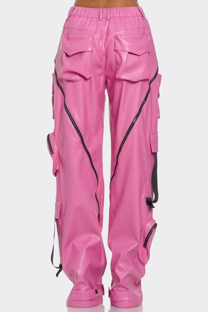back view of pink leather high waisted cargo wide leg pants for women high fashion with oversized pockets, zipper details and adjustable straps