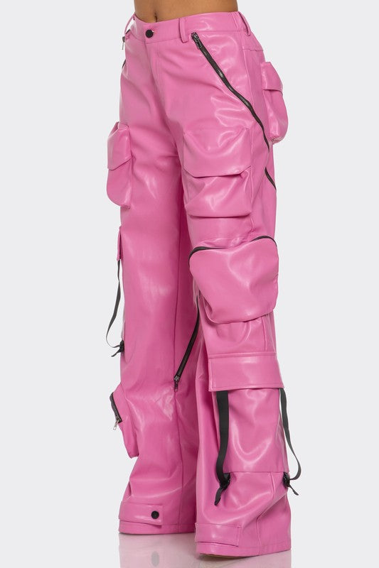 side view of woman posing in a high-waist pink cargo trousers with oversized pockets
