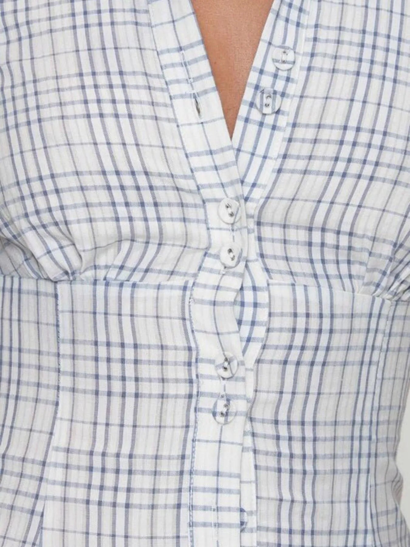 Close-up blue plaid short sleeve shirt on model