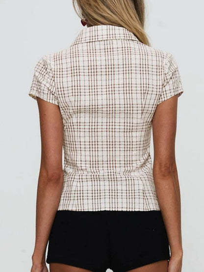 Model in plaid khaki short sleeve button-up shirt with relaxed fitted look back view