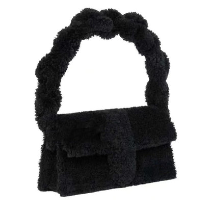 Soft fuzzy black sherpa purse with structured flap and chunky handle