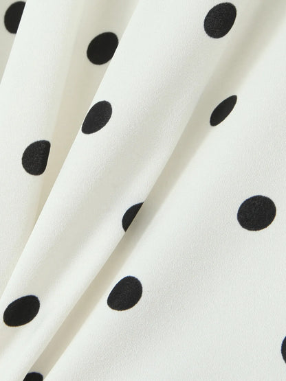Close-up of polka dot fabric of halter neck mini dress
