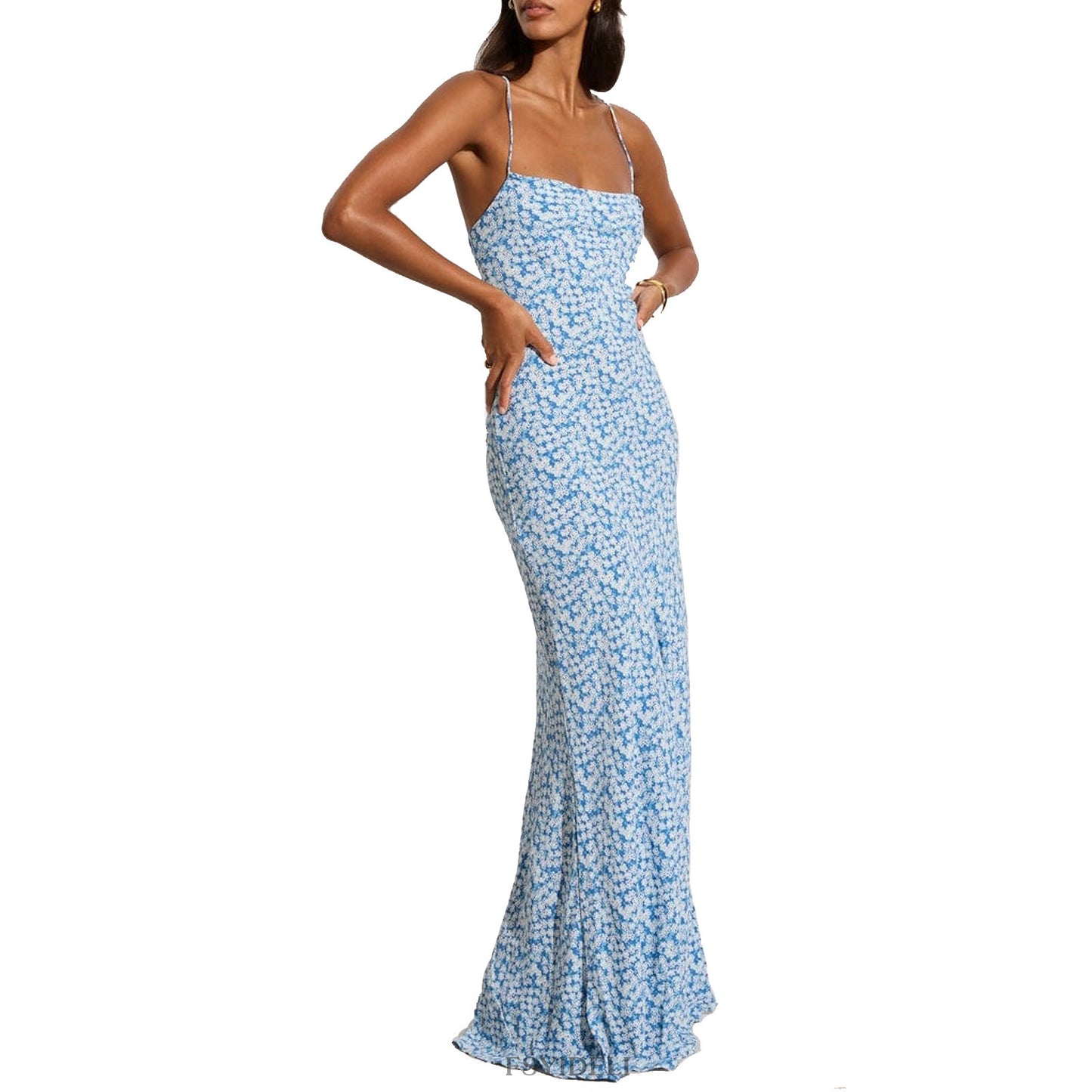 Model wearing a printed blue floral dress with a backless and lace-up feature front view