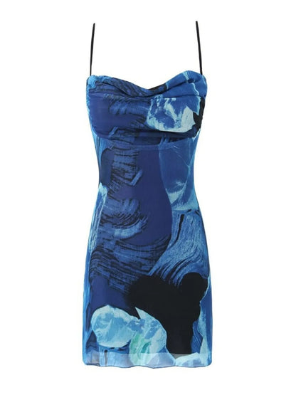 Blue mini cami dress with floral pattern on a white background