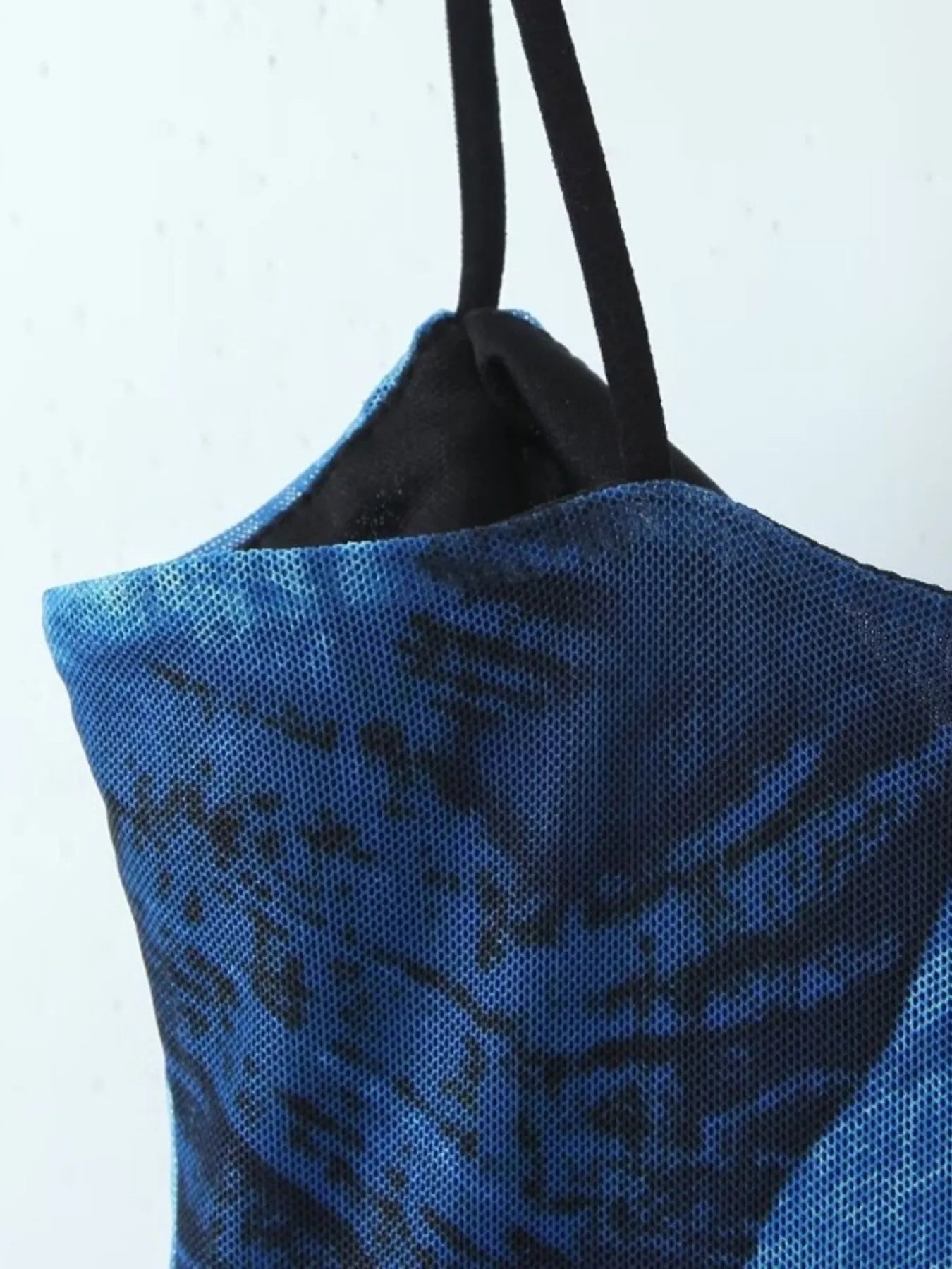 Blue floral mini cami dress  sleeve close up on a white background
