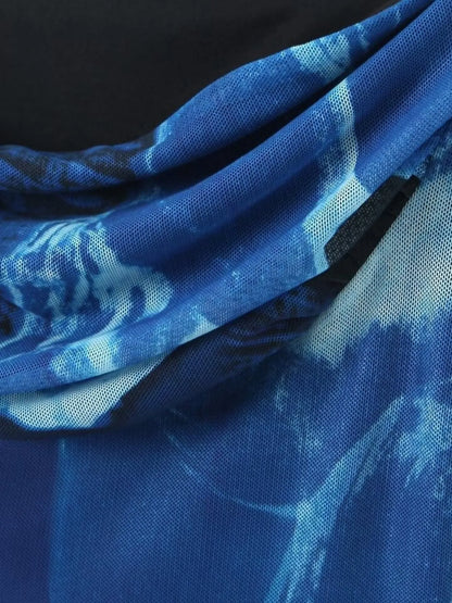 Close-up of blue fabric with floral pattern of mini cami dress