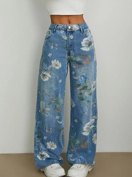 Front view of woman wearing blue floral printed relaxed wide leg loose high rise jeans on a plain background