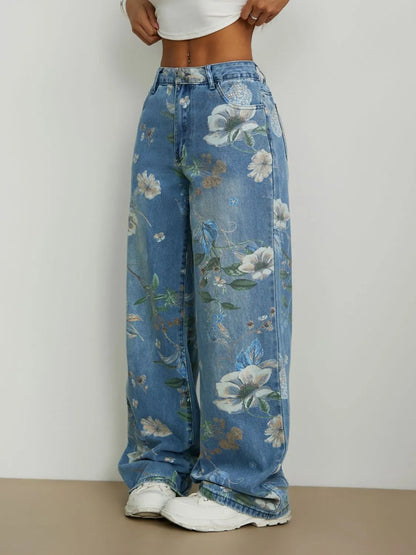 Woman wearing Blue all over printed floral  design high rise  wide leg jeans on a plain background