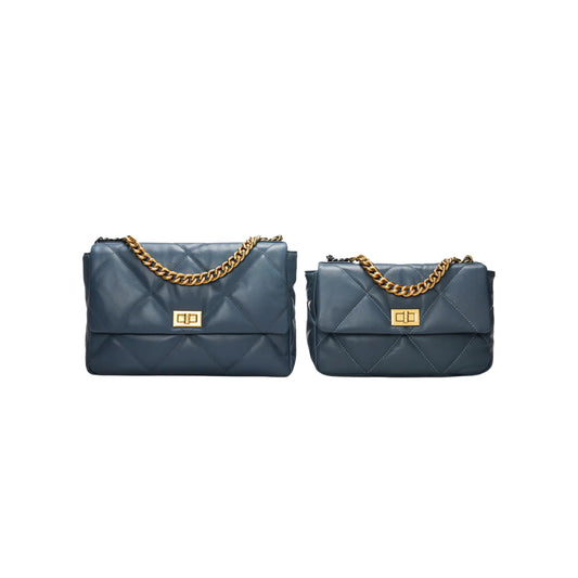 Blue quilted diamond pattern handbags one large one small on a white background