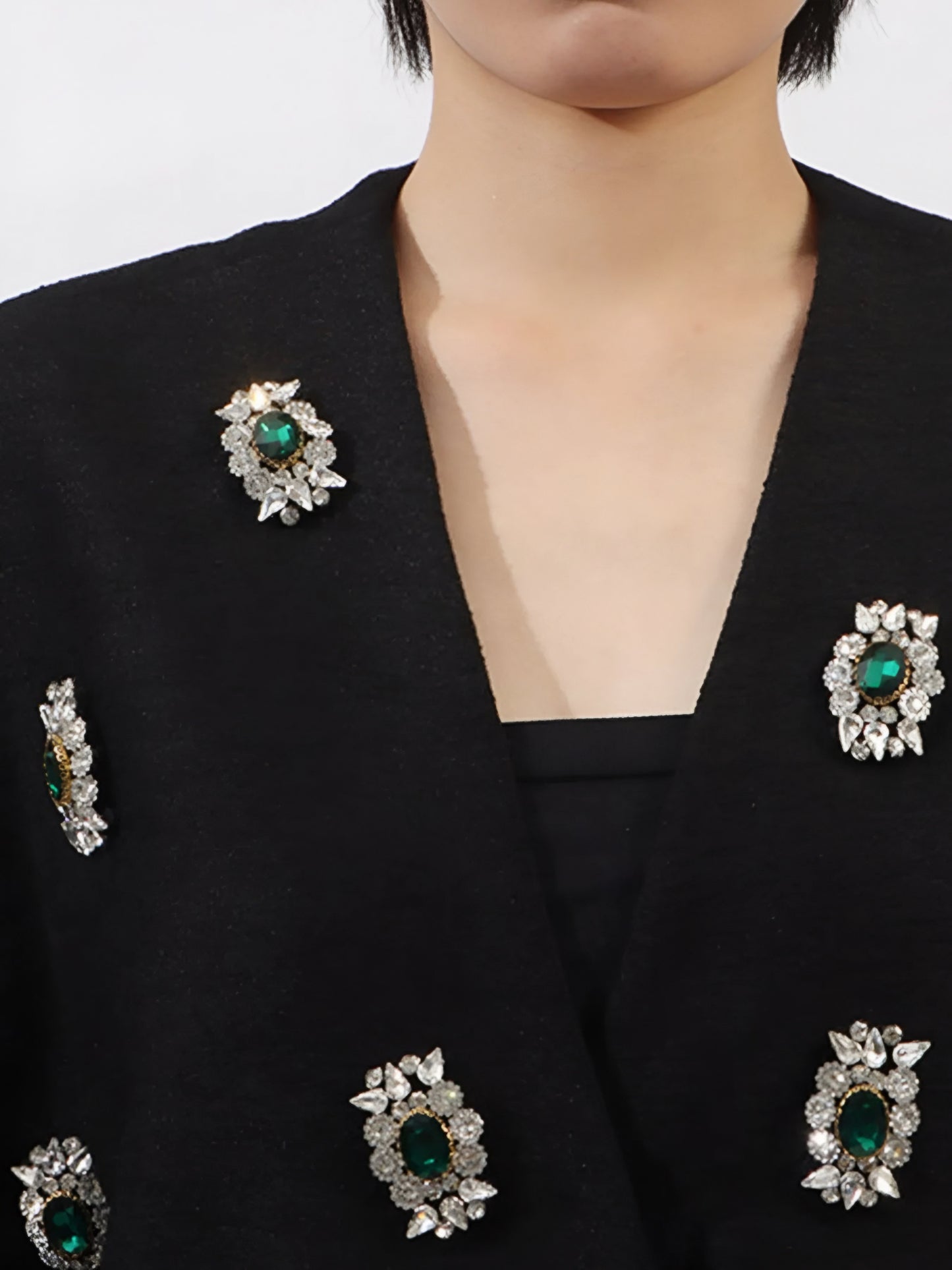 close up neckline of black statement sparkle vest coat with crystal rhinestone gems in inclusive sizing M–3XL