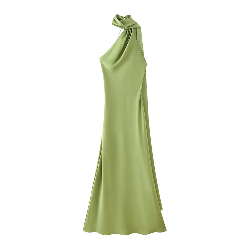 Front view of a flowy green halter ribbon dress 