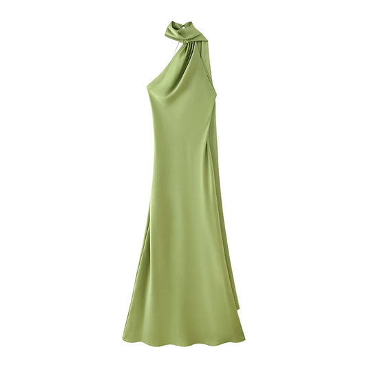 Front view of a flowy green halter ribbon dress 