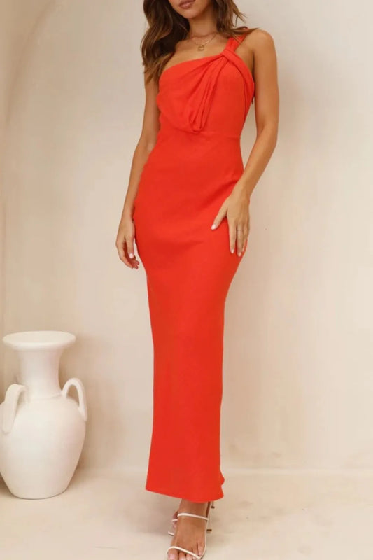 Model wearing ruched one-shoulder maxi dress with asymmetrical neckline in a neutral background 