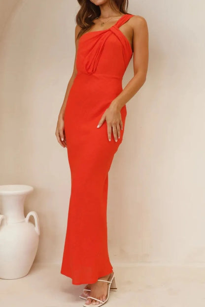 Model wearing ruched one-shoulder maxi dress with asymmetrical neckline