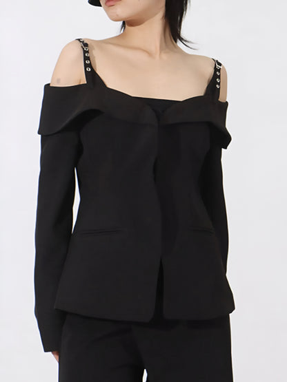 woman wearing black cold Shoulder Buckle Strap Blazer with ruffled details on a white background