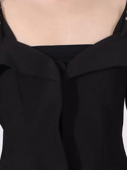 close up of neckline of designer inspired fashion black off-shoulder blazer/jacket on a white background