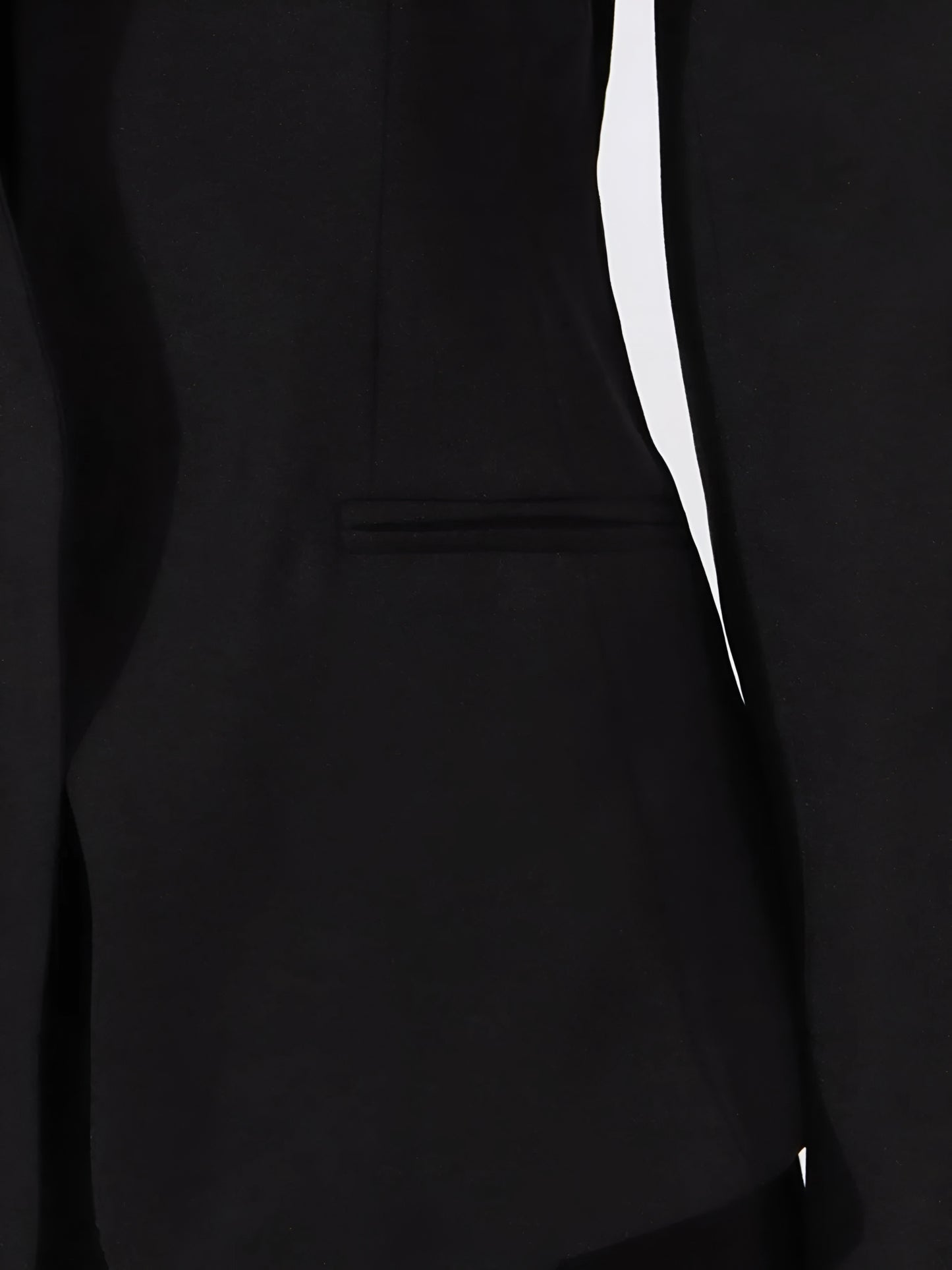 close up of pocket of Black off-shoulder blazer/jacket on a white background