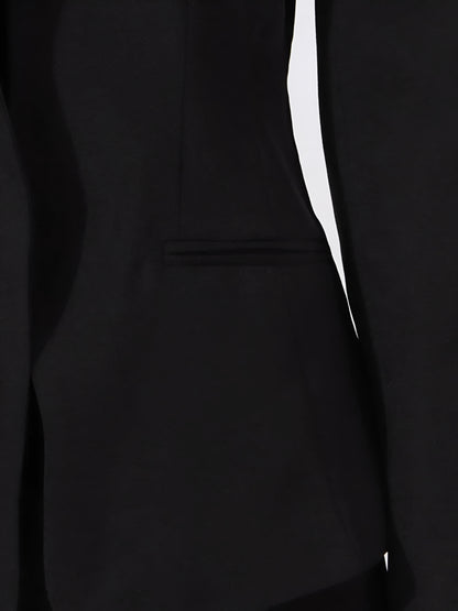close up of pocket of Black off-shoulder blazer/jacket on a white background