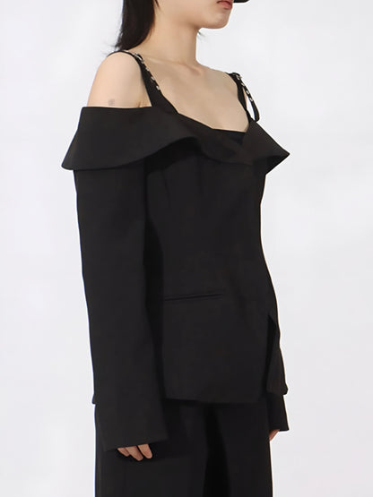 Side view of woman wearing edgy cold Shoulder Buckle Strap black Blazer on a white background
