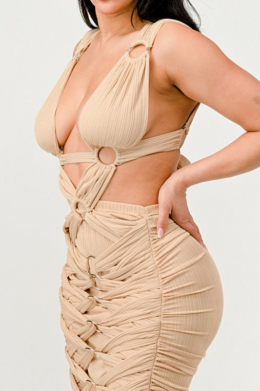 side view of Sahara Mystique pleated gown in beige with open back tie closure, cutout detail and ruching on model